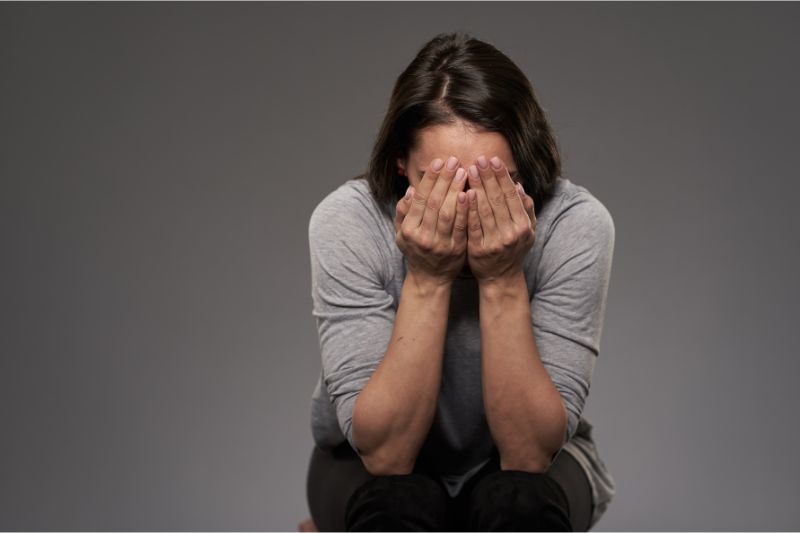 person saddened by the return
